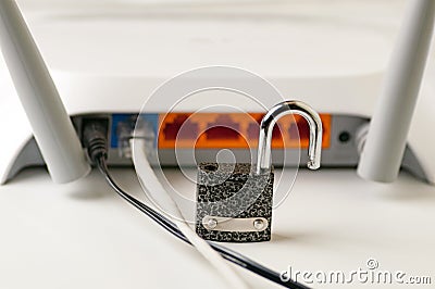 Lock unlock security .Protecting the Internet connection through a wi-fi router is a concept of a security breach. Cyber security. Stock Photo