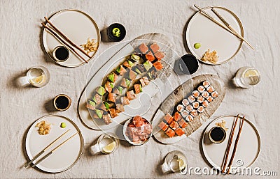 Flat-lay of Japanese salmon prawn crab and vegan rolls Stock Photo