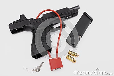 Locked disarmed and secured automatic gun on white background Stock Photo