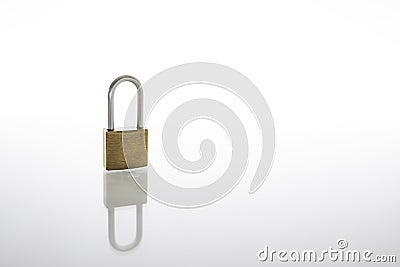 Locked padlock as security or privacy concept, isolated on white background with reflex Stock Photo