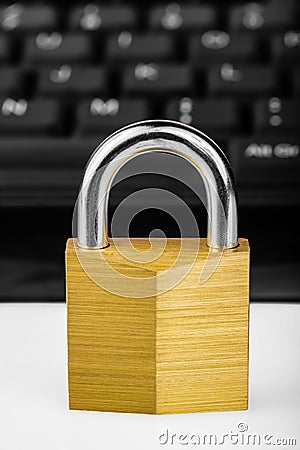 Locked padlock with a black computer keyboard Stock Photo