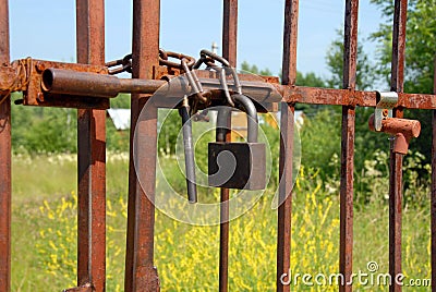 Locked rusty gate Stock Photo