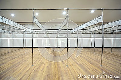 Locker room is constructed from pipes with hooks Stock Photo