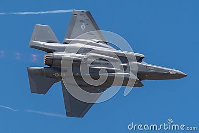 Lockheed Martin F-35 Lightning II performing Aerobatics at Hill AFB in blue sky Editorial Stock Photo