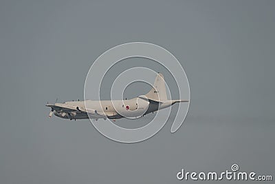 Lockheed P-3 Orion in gray sky Editorial Stock Photo