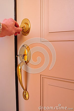 Locking a Dead Bolt Stock Photo