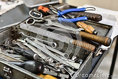 Locksmith`s box with keys and tools for repairing mechanical equipment Stock Photo