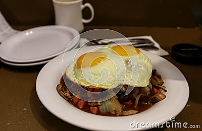 Loco Moco , traditional Hawaiian cuisine , burger patty on rice with a fried egg and brown gravy sauce Stock Photo