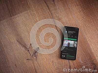 Enlight Quickshot app play store page on mobile smartphone on wooden background Editorial Stock Photo