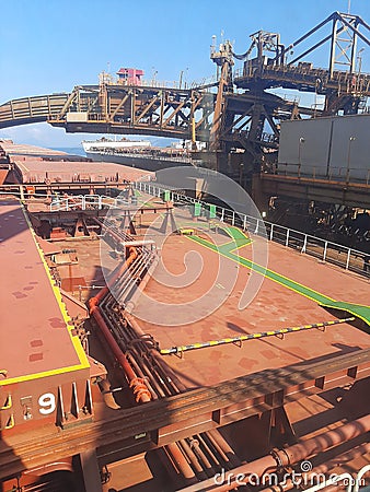 Loding bulk carrier ship onboard seamen Stock Photo