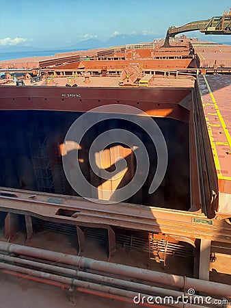 Loding bulk carrier ship onboard seamen Stock Photo