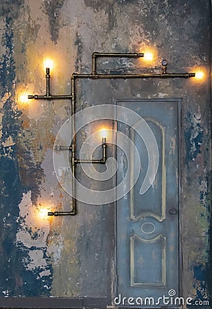 Loft style wall with a door and steampunk pipes Stock Photo