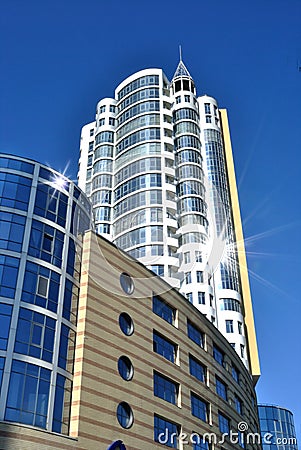 The lofty white building is against dark blue sky Stock Photo