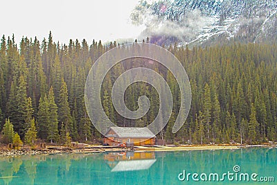 Log cabin on Lake Louise Stock Photo