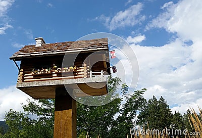 Log House Birdhouse, Christina Lake, BC Stock Photo