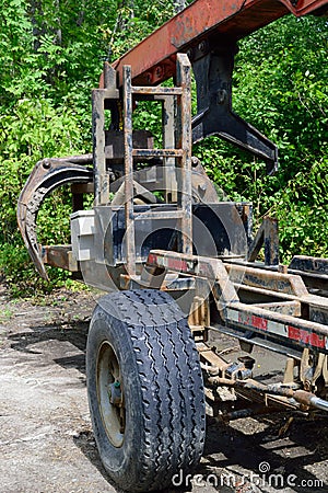 Log Loader Trailer and Grapple Stock Photo