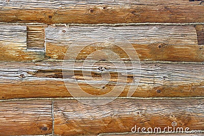 Log masonry from thick old cracked logs, wood structure, cracks and knots, wooden background Stock Photo