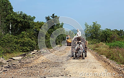 Log truck on an under construction road Editorial Stock Photo