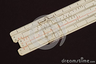 Logarithmic ruler on a colored background. Stock Photo