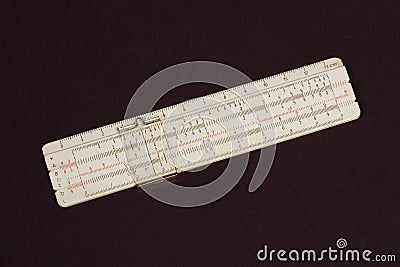 Logarithmic ruler on a colored background. Stock Photo