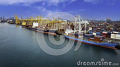 Logistic container ship from sea port warehouse with working crane bridge for delivery containers shipment Stock Photo