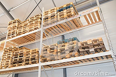 Logistics hangar warehouse with lots shelves racks with pallets Stock Photo
