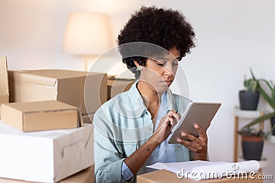 Logistics manager examining parcel tracking Stock Photo