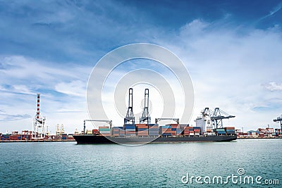 Logistics and transportation of International Container Cargo ship with ports crane bridge in harbor for logistic import export ba Stock Photo