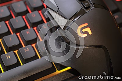 Logitech g502 hero gaming mouse on red illuminated gaming keyboard, close up shot. devices to play on the pc. Verona, 08-02-21 Editorial Stock Photo