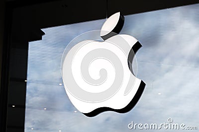 Logo of Apple Inc. on a Apple store. Apple is the multinational technology company headquartered in Cupertino, California. Editorial Stock Photo