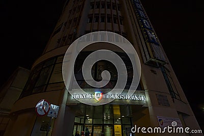 Logo of Banca Transilvania Bank of Transylvania at night on a Brasov office of the company. Editorial Stock Photo