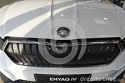 Logo on cap, white skoda Enyaq electric car, automobile details, Czech manufacturer, Volkswagen AG, automotive engineering, Editorial Stock Photo