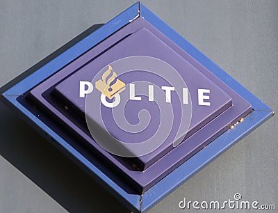 Logo of the dutch police force named Politie in a rectangle in blue on station in the Netherlands Editorial Stock Photo