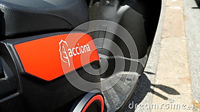 Logo highlighted on scooter sharing ACCIONA Spanish company founded in 1997, a group consisting of over 100 companies active in va Editorial Stock Photo