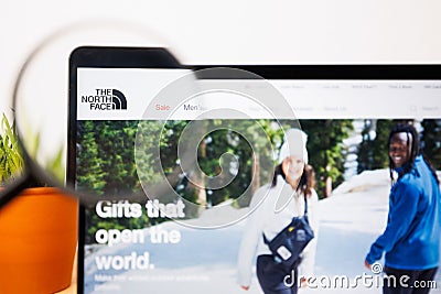 Logo of The North Face under a magnifying glass. The North Face Website on Laptop screen Editorial Stock Photo