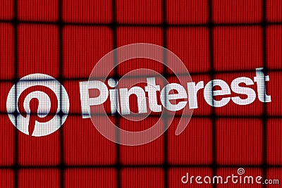 The logo of the Pinterest social media service behind bars. The concept of Pinterest censorship and prohibition Editorial Stock Photo