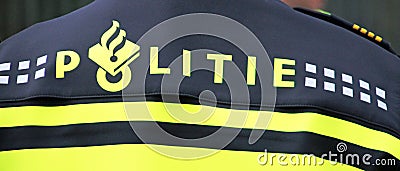 Logo of the police in the Netherlands named Politie on the back of a officer. Editorial Stock Photo