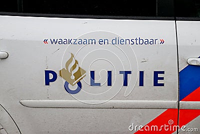 Logo of the police in the Netherlands named Politie with the blue and red striping on a police car. Editorial Stock Photo