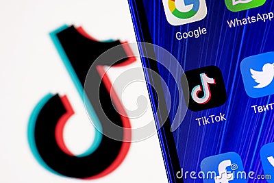 The logo of the social network TikTok behind bars. The concept of TikTok censorship and prohibition Editorial Stock Photo