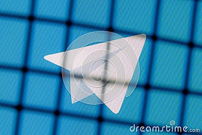 The logo of the Telegram messenger behind bars. The concept of Telegram censorship and prohibition Editorial Stock Photo