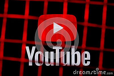 The logo of the Youtube social media platform behind bars. The concept of Youtube censorship and prohibition Editorial Stock Photo