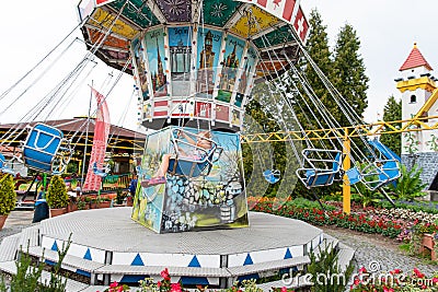 Loifling, Germany - 26 July, 2018: Merry-go-round swings for children. Little girl have fun in Churpfalzpark Loifling amusement Editorial Stock Photo