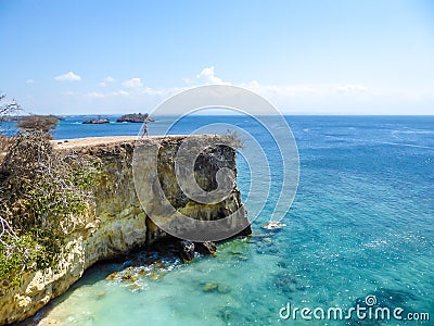 Lombok - A boy and the Pink Beach Cliff Stock Photo