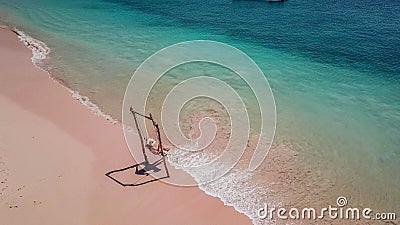 Lombok - girl on the swing Stock Photo