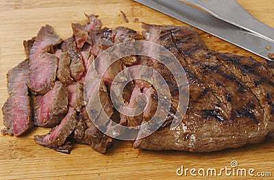 London broil sliced on a board Stock Photo