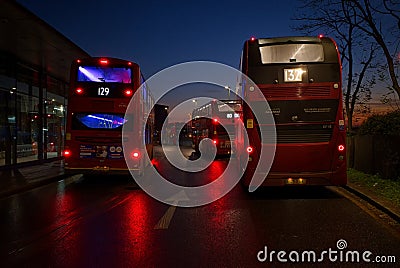 London buses, outside North Greenwich tube station at sunset. Editorial Stock Photo