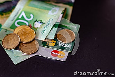 London Canada, August 18 2019: Canadian money and Credit Cards. .Editorial concept of finance, debt, and money Editorial Stock Photo