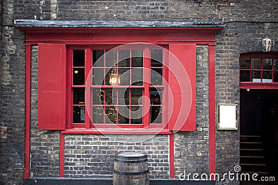 Window with red shutters, decorated with a drawing with a horse in a traditional Christmas style about the south bank in London Editorial Stock Photo