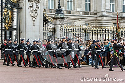 LONDON, ENGLAND - JUNE 17 2016: British Royal guards perform the Changing of the Guard in Buckingham Palace, London, Grea Editorial Stock Photo