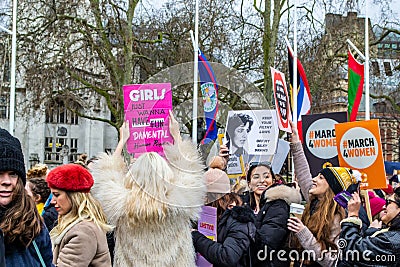 LONDON/ENGLAND â€“ MARCH 8th 2020: Smiling participants at the MARCH 4 WOMEN protest in London Editorial Stock Photo